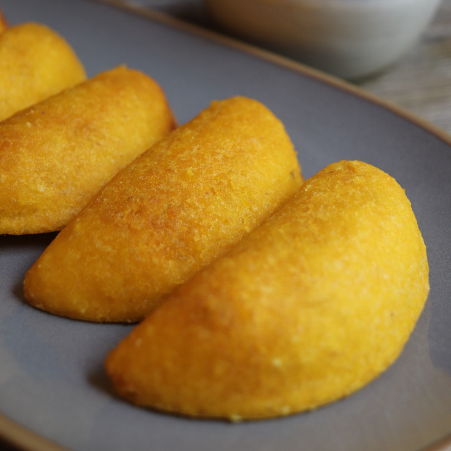 Colombian cheese empanadas served on dish. Delicious colombian cheese snack.
